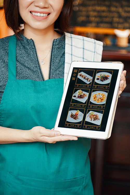 Waitress showing menu with dishes, available for online order and delivery