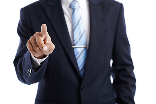 Close-up image of entrepreneur pointing at invisible interface