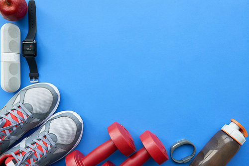 Blue background with various sport equipment on it