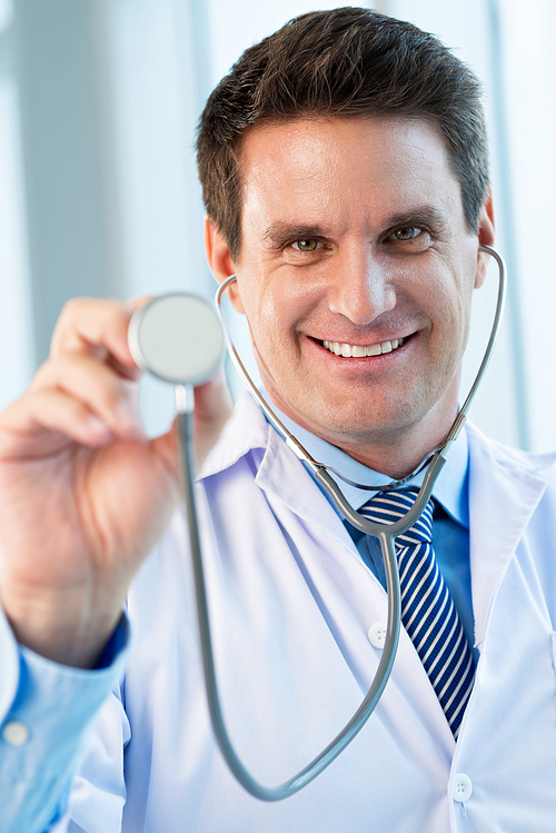 Portrait of happy handsome doctor with stethoscope