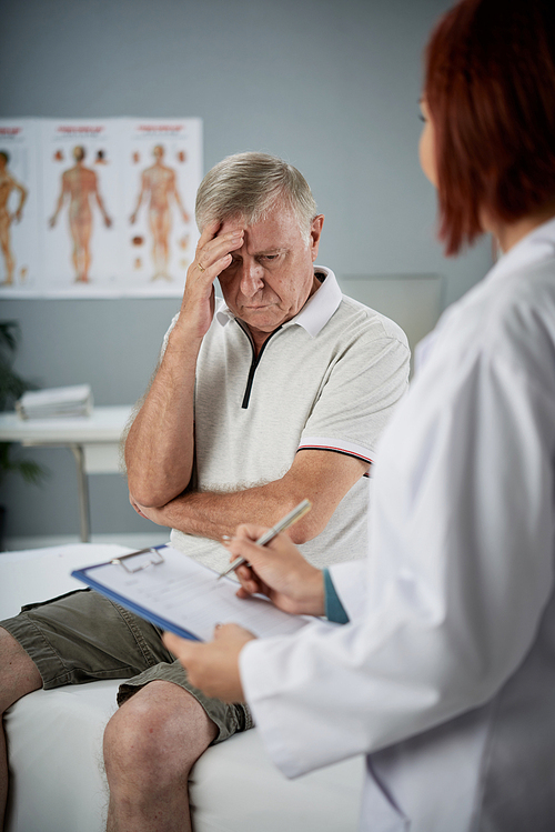 Upset senior man listening to his diagnosis