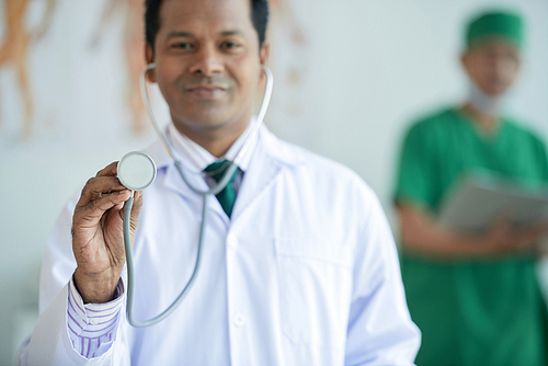 Portrait of confident doctor holding stethoscope