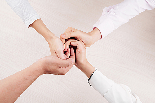 Close-up of tender family holding hands loving and support each other over white background
