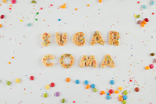 Sugar coma inscription made of sweet decorated cookies