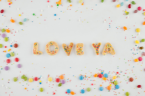 Love ya words made of homemade sugar cookies decorated with colorful sprinkles