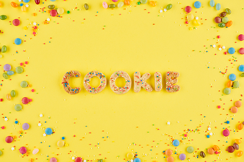 Cookie word made from sweet baked letters decorated with sprinkles