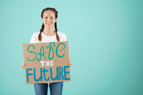 Female activist holding save the future paper sign, isolated on light blue