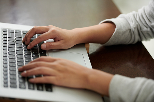 Hands of woman typing on keyboard, freelancing and studying online concept