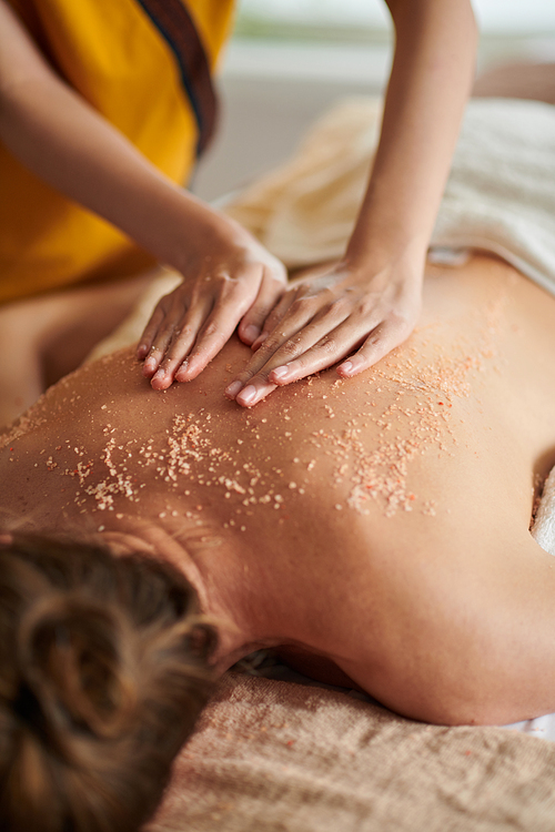 Closeup image of woman enjoying delux treatment in spa salon