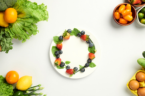 Fresh strawberries and blueberries on plate, healthy snack concept