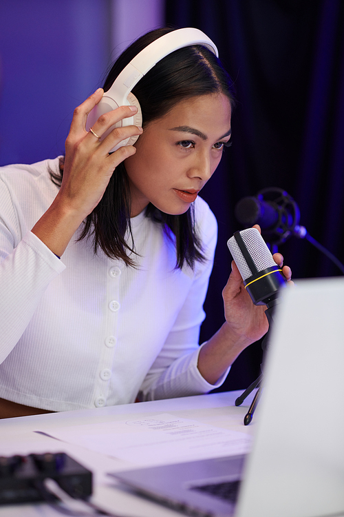 Blogger testing new microphone before recording podcast for blog