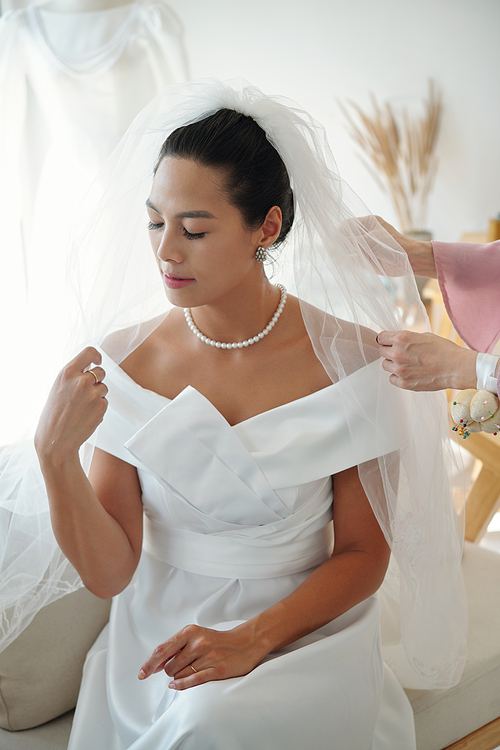 Bride visiting wedding salon for fitting