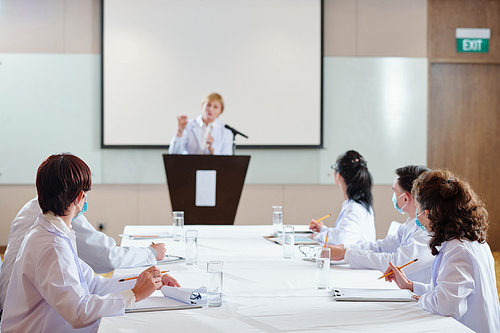 Group of researchers attending conference on coronavirus treatment and new vaccine development