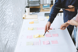 Cropped image of business team checking project roadmap