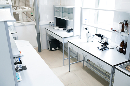 Interior of empty science laboratory in modern clinic, copy space