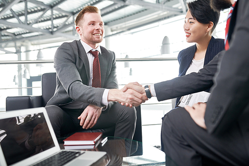 Business people shaking hands, finishing up a meeting