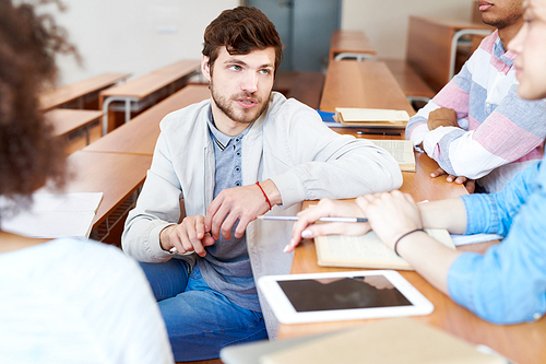 Group of students communicating at class during a break