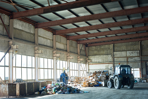 Wide angle image of industrial warehouse of modern waste processing plant, plastic bags of garbage and transporting vehicle in empty space
Storage on Waste Processing Plant