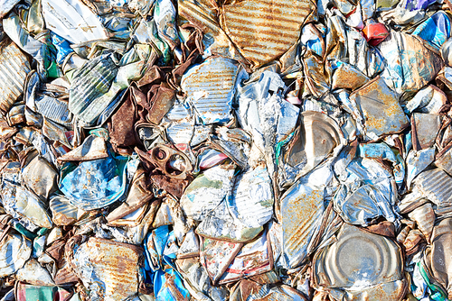 Close up background of crushed trash block at modern recycling factory, copy space