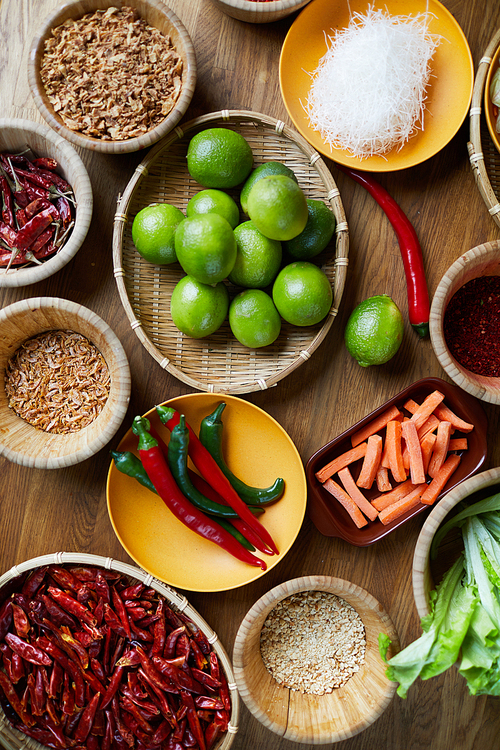 Above view background of various spices in wooden bowls on table, copy space