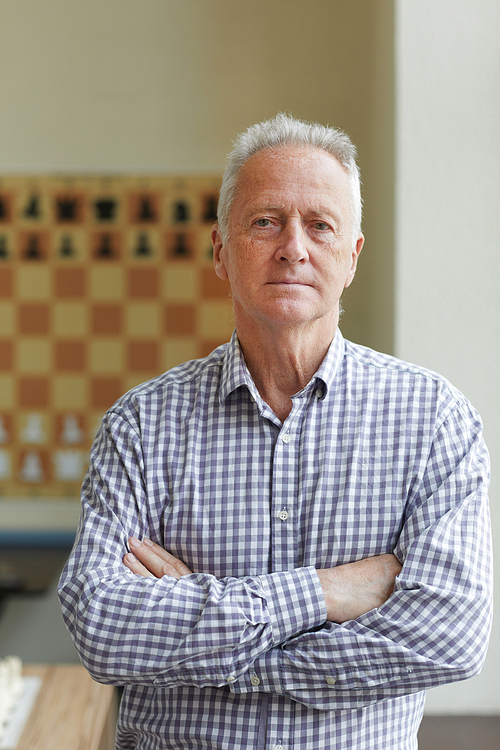 Experienced professional grandmaster posing for pictures for his book about playing chess