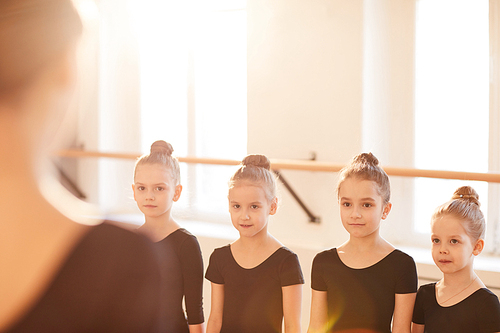 group of little girls standing in line during dance class, copy space