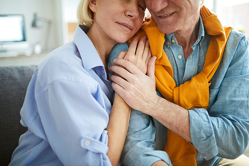 Close up portrait of mature couple in love embracing tenderly