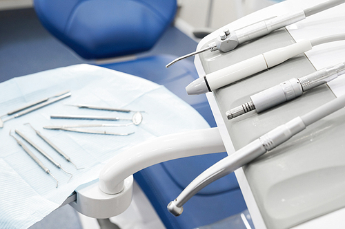 Above view of dental tools and instruments lying on table in dentists office, copy space