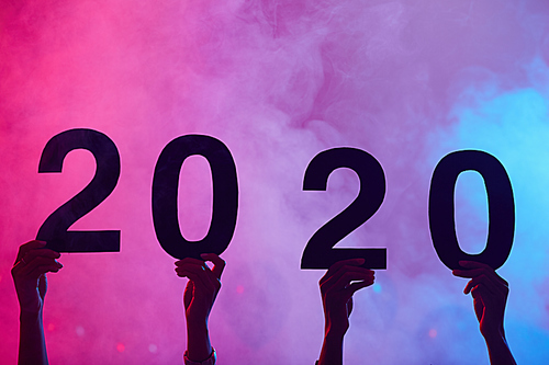 Background image of hands holding 2020 during New Year party in nightclub, copy space