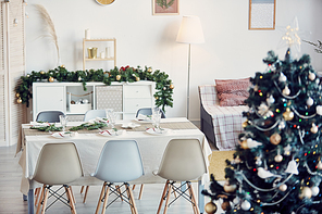 Background image of elegant dining room decorated for Christmas party in subtle gold and silver tones, copy space