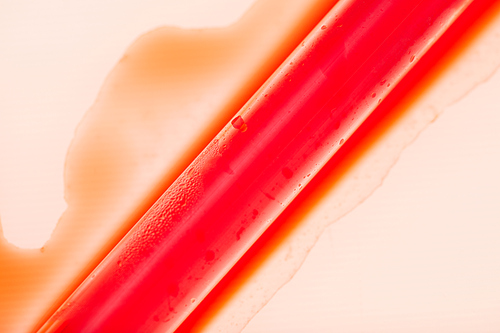 Above view background of blood spilling around test tube sample in medical laboratory, copy space