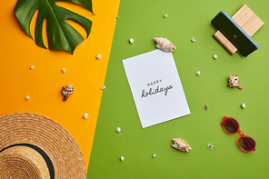 Bright color pop composition of Happy holidays note over graphic tropical background with vacation vibes, copy space