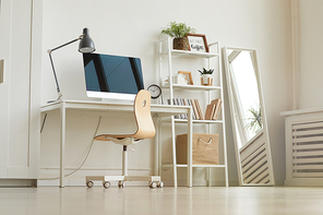 Background image of modern home office workplace in clean all-white design interior, elegant detail in mirror reflection, copy space