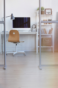 Vertical background image of empty office workplace behind glass wall in minimal design, copy space