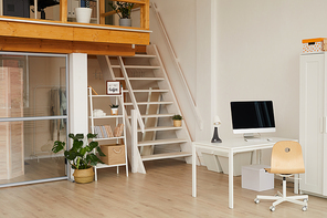 Background image of contemporary two level apartment interior with home office workplace in foreground, copy space