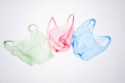Above view image of recyclable plastic bags isolated on white, waste sorting and management concept, copy space