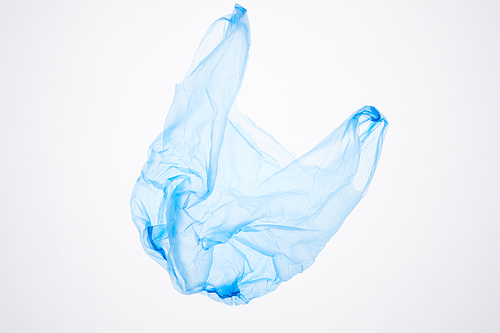 Above view at blue plastic bag floating isolated on white, waste sorting and management concept, copy space