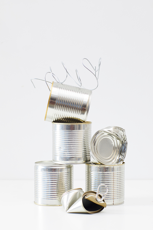 Minimal composition of discarded metal cans isolated on white, waste sorting and recycling concept, copy space