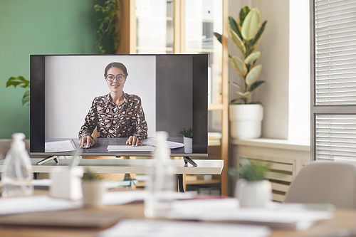 Background image of smiling businesswoman on computer screen during online business conference, copy space