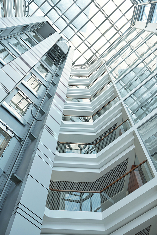 Below view of walls and windows of high contemporary business center that you can use as background