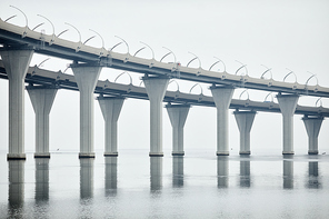 Minimal background image of industrial high tech bridge in water, copy space