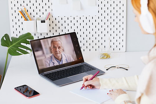 Close up of unrecognizable woman working at home during online meeting with manager, copy space