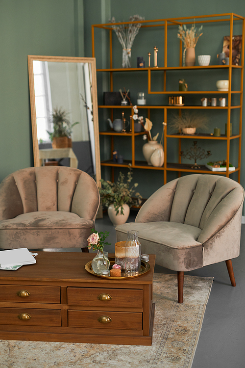 Vertical background image of elegant salon interior with comfy velvet armchairs and antique furniture in green tones