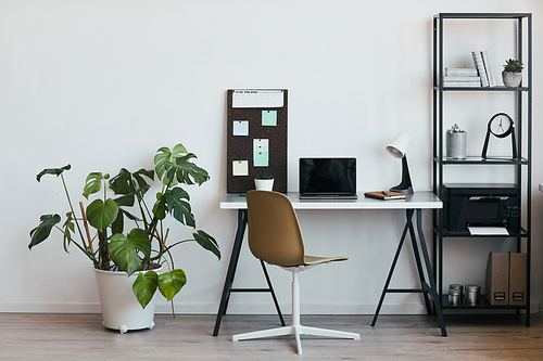 Background image of minimal home office workplace with laptop and accessories in black and white, copy space