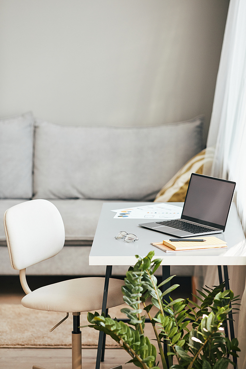 Vertical background image of cozy home office interior in white color, copy space