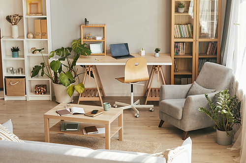 Wide angle background image of cozy home office interior with wooden decor, copy space