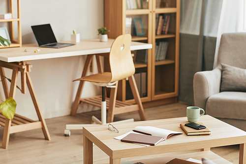 Closeup background image of cozy home office interior with wooden decor, copy space