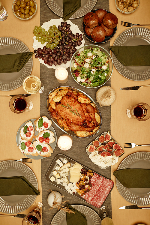 High angle view of dining table with turkey and salads on it for dinner party