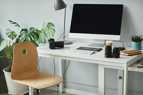 Background image of minimal photographers workplace with computer set up for photo editing