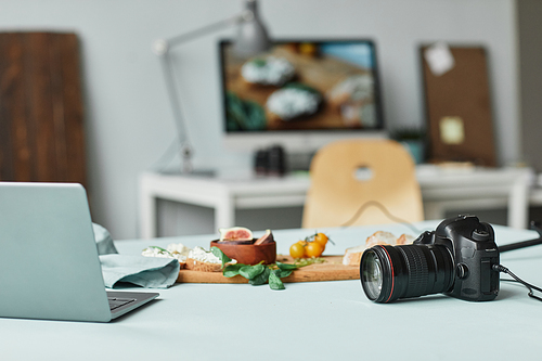 Background image of food photographers studio with focus on camera, copy space